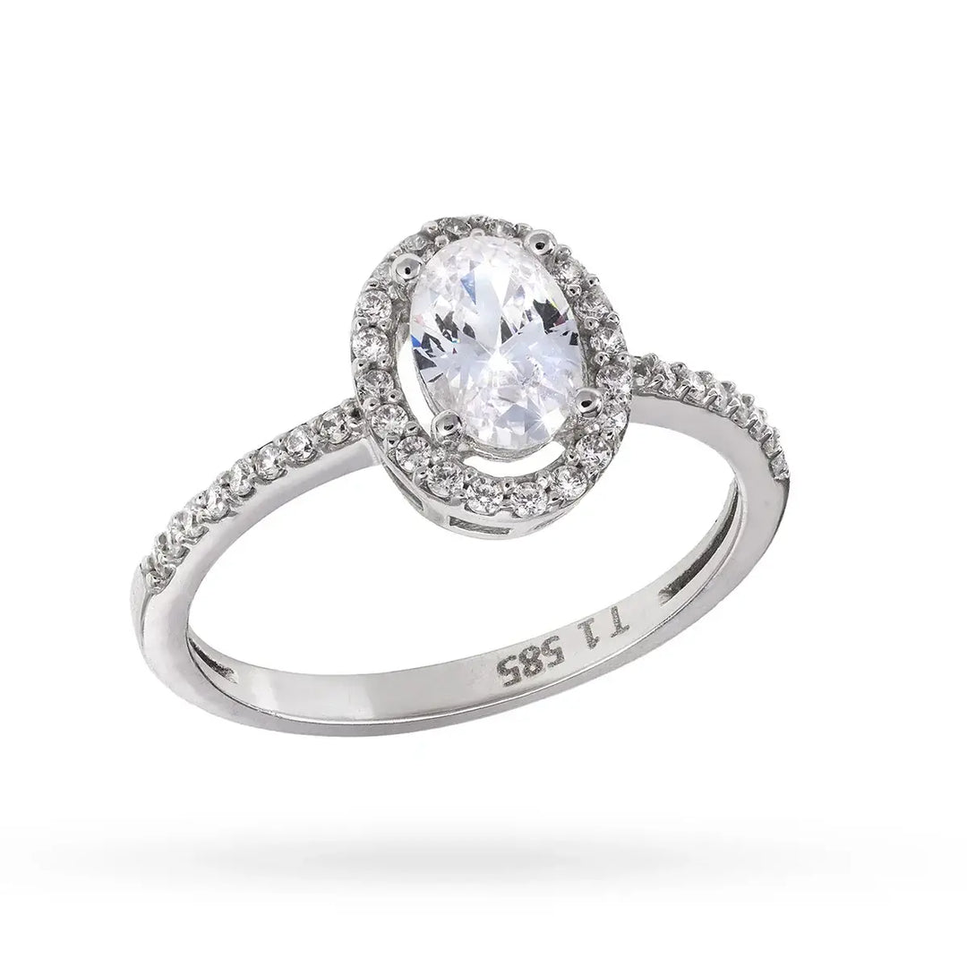 Бял златен пръстен с овален централен циркон и малки камъни