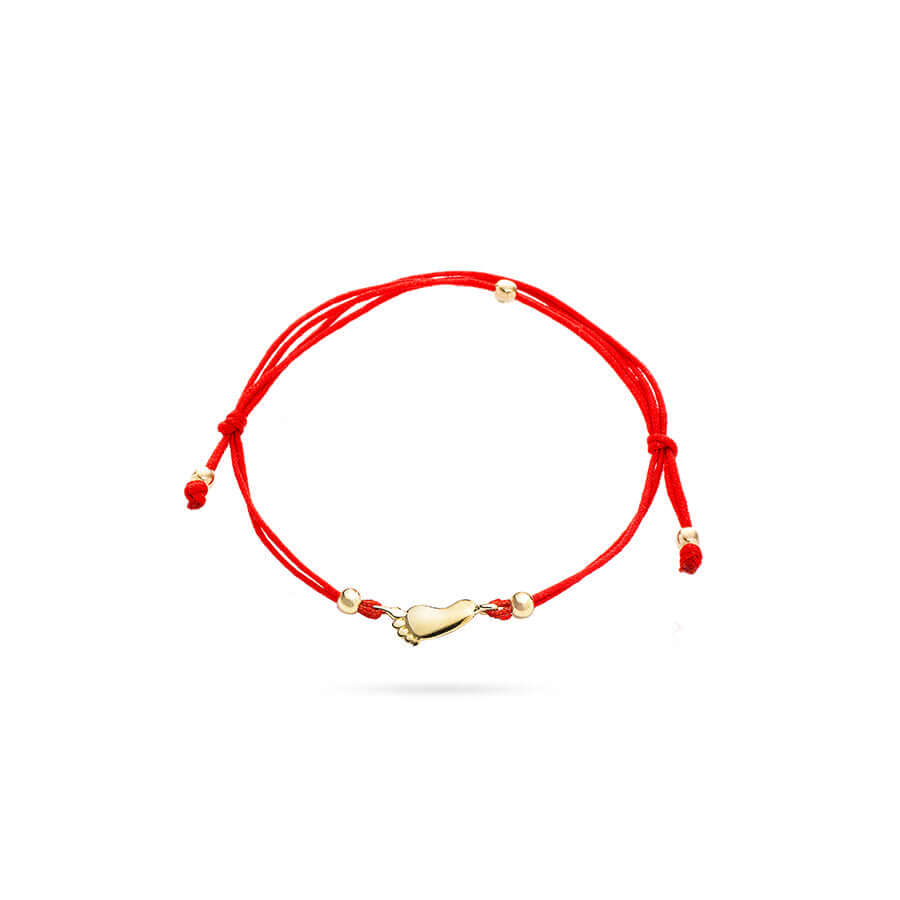 Гривна с червен конец и златен елемент  краче.